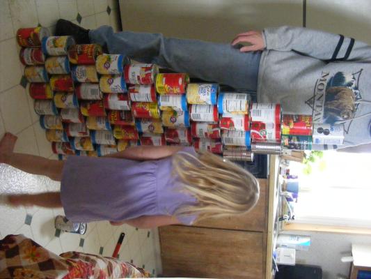a tower of canned vegetables and soup