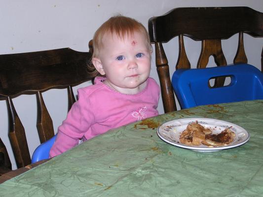 Sarah sits at the table.
