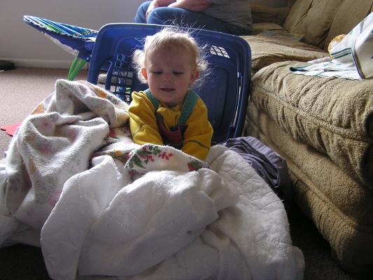 Noah helps with the laundry.