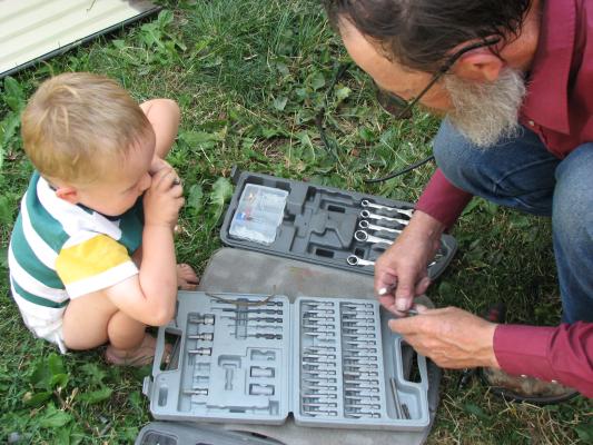 Noah plays with grandpa's tools