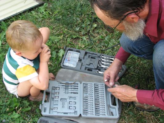 Noah plays with grandpa's tools