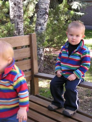 Noah and Sarah climb on the bench.