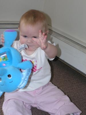 Sarah plays with her new elephant.