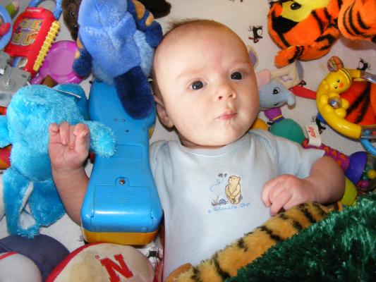 Noah got all the baby toys for Joshua to play with.