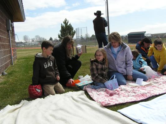 Deb tells the story of Easter to the kids.