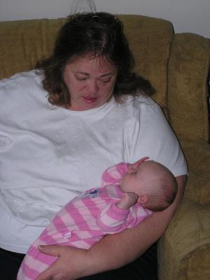 Mary holds her new granddaughter.