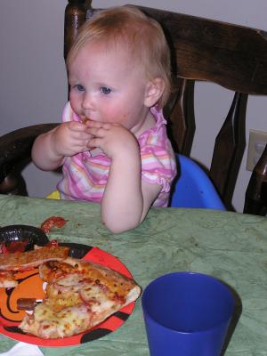Sarah enjoys some pizza