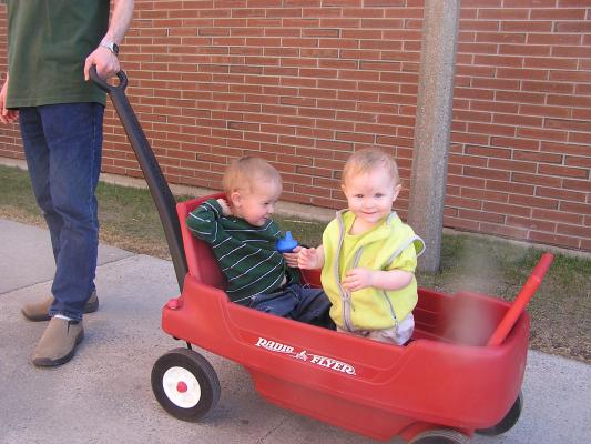 Noah and Sarah ride in the wagon. 
They are wearing green for St. Patrick's Day.