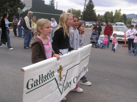 Girls carrying sign in the parade