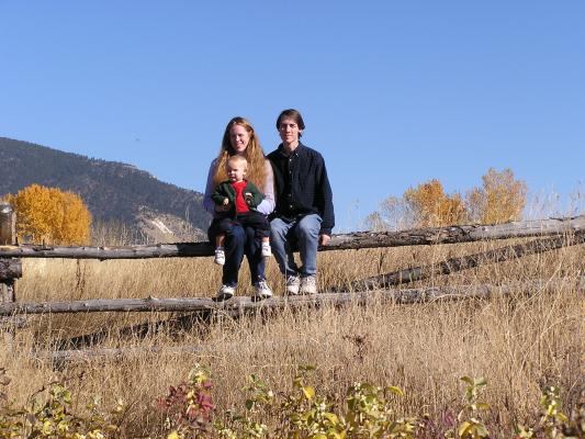 Family portrait on the fence with the M in the background.