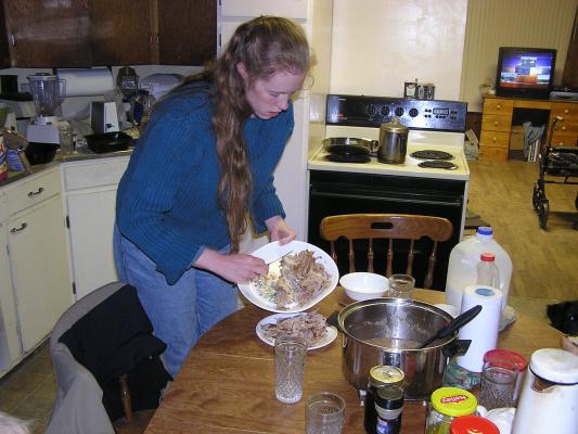 Putting turkey on a smaller plate.