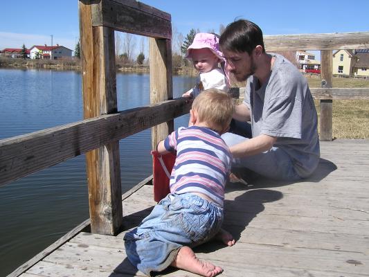 Noah and throw rocks off the dock.