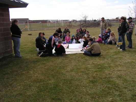 Deb tells the story of Easter to the kids.