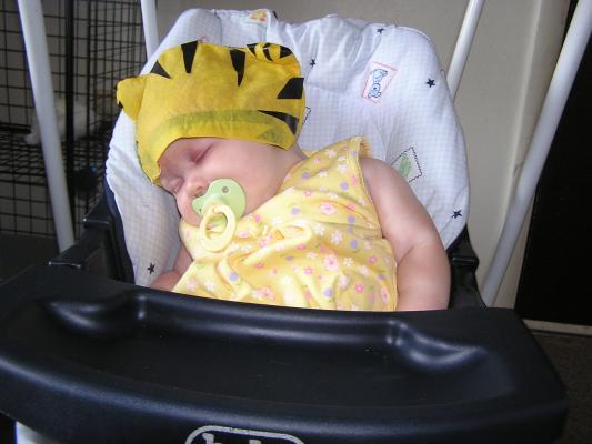 Sarah wears Noah tiger hat.