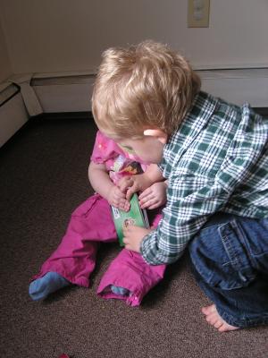 Noah decides it's the big brother's job
to take the books away from his sister.