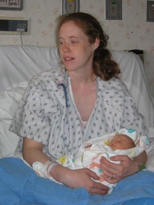 Katie hold her new baby girl.