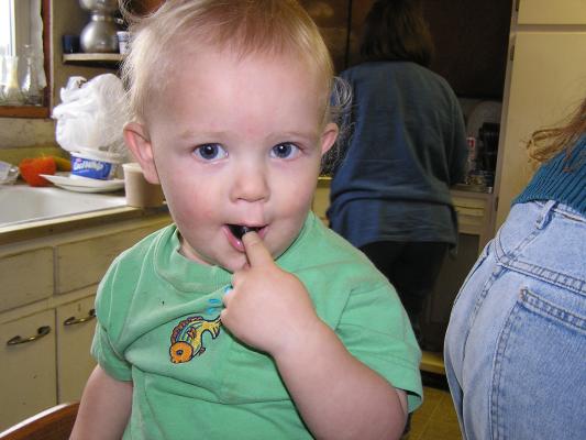 Noah eats an olive.