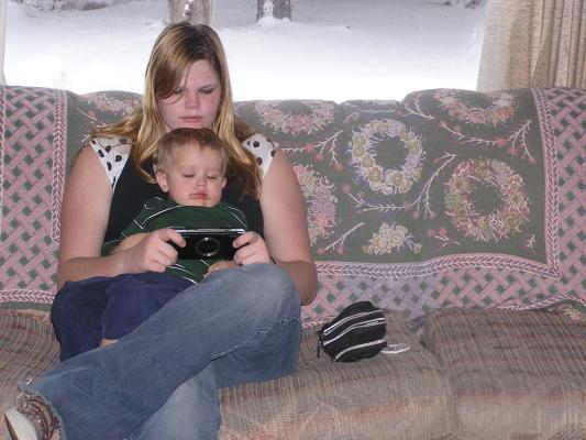 Lacey puts Noah to sleep playing Video games.