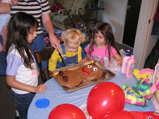Katie cuts the bear to strips.