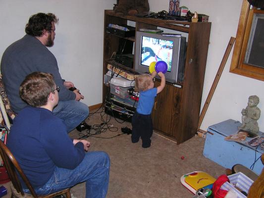 Noah helps Benji with his games.