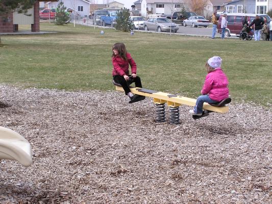 Kids play at the park before the Easter egg hunt.