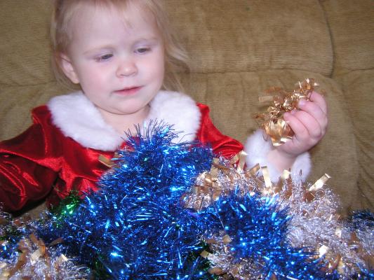 Sarah plays with the tinsel.