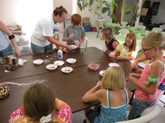 Making keychains at the craft table with Kathy.