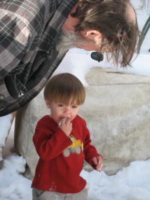 Johnathan eats some snow.