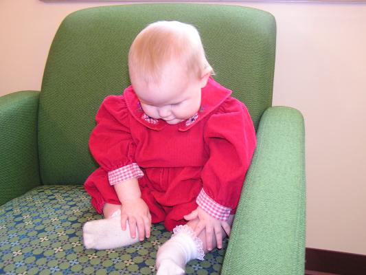 Sarah on a chair at the library
