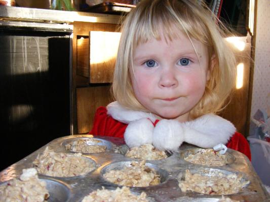 Santa Sarah makes muffins.