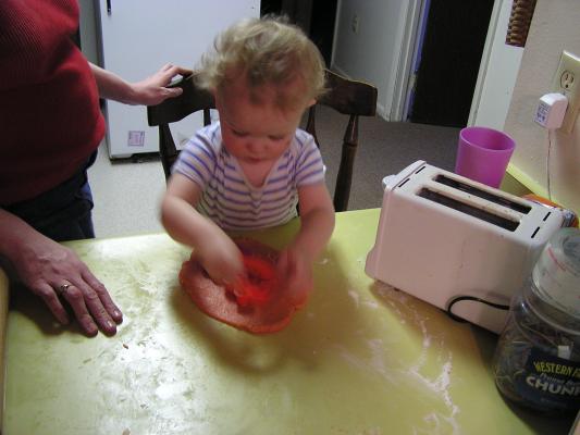 Noah cuts out sugar cookies for Valentines Day.
