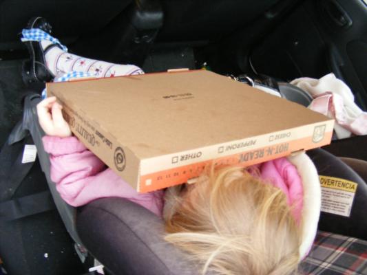 Sarah sleeping under pizza.