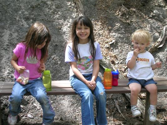 Andrea, Malia and Noah take a break on the bench.