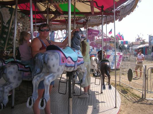 A stranger standing in front of Katie at the fair.
