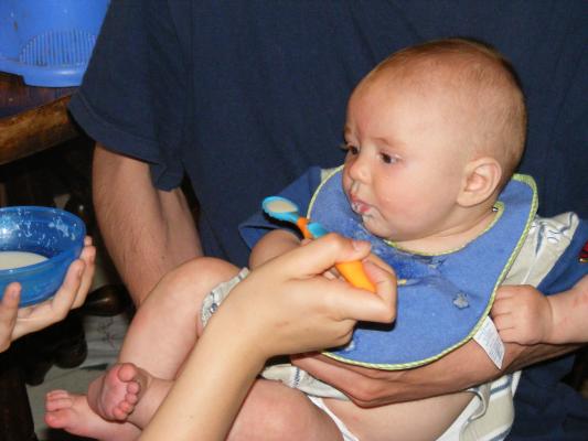 Joshua eats rice cereal