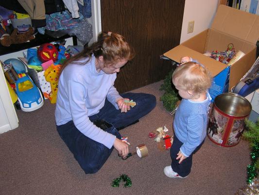 Katie and Noah repair an ornament.
