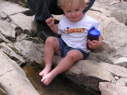At the top of the falls is some little water puddles.