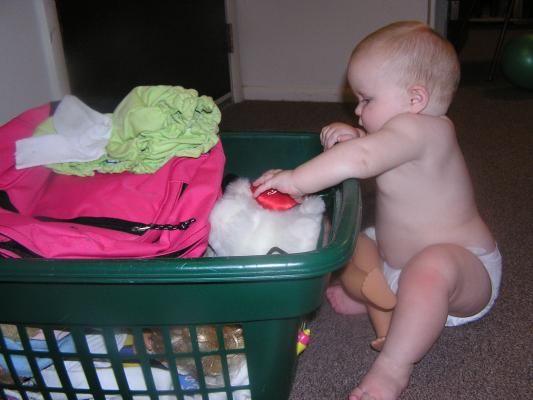 Sarah looks for another toy from the basket.