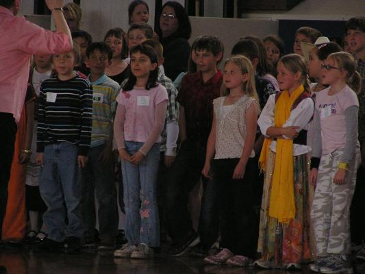 Malia singing with her class.