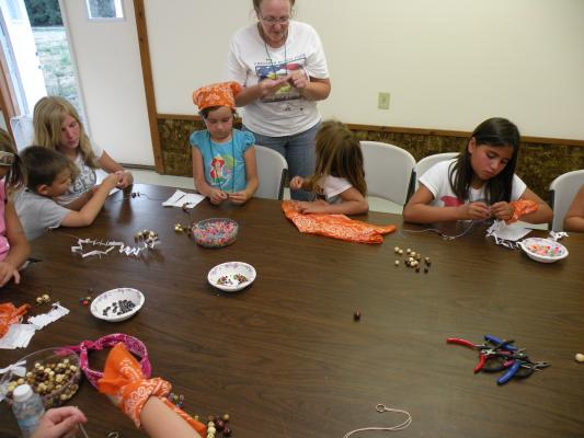 Orange Aspens at the craft table.