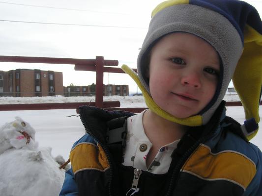 Noah is playing in the snow.