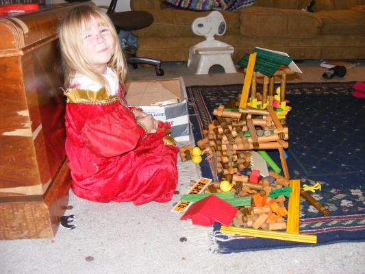 Sarah and the cazy Lincoln Log house.