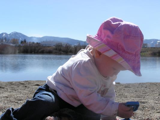 Sarah digs in the sand.
