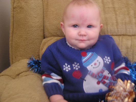 Trying to get a good Christmas photo of Sarah.
She has a new blue sweater.