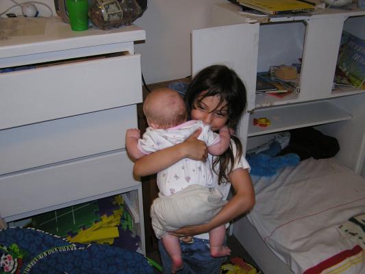 Andrea holds Sarah.