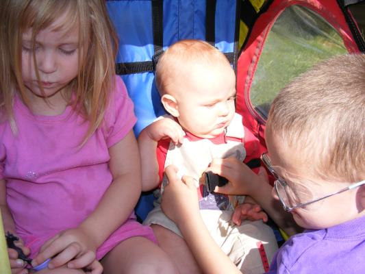 Sarah, Joshua and Noah in the bike trailer