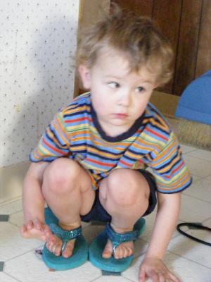 Noah in Mom's shoes.