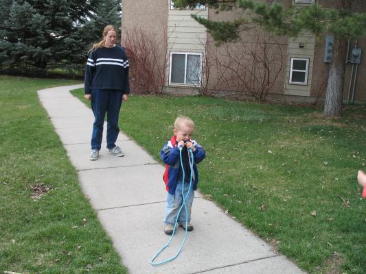 Noah plays with a jumprope.