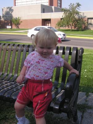 Sarah on a bench at the duck pond.