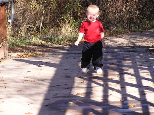Noah walks on a bridge.